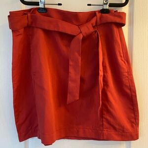 NWT Banana Republic skirt. Size 16. Colour is red orange.